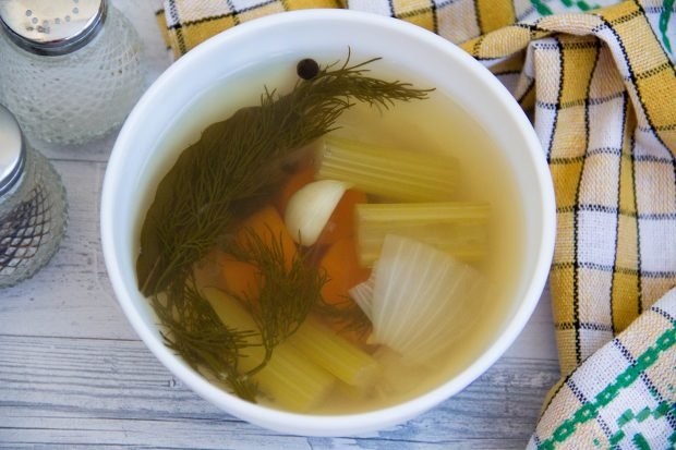 Vegetable broth with carrots and herbs