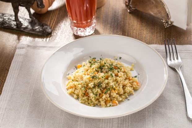 Barley porridge with carrots and herbs