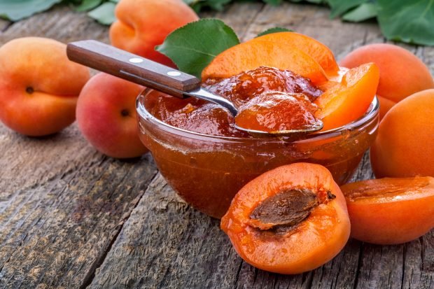 Dense jam from apricots with slices without bones